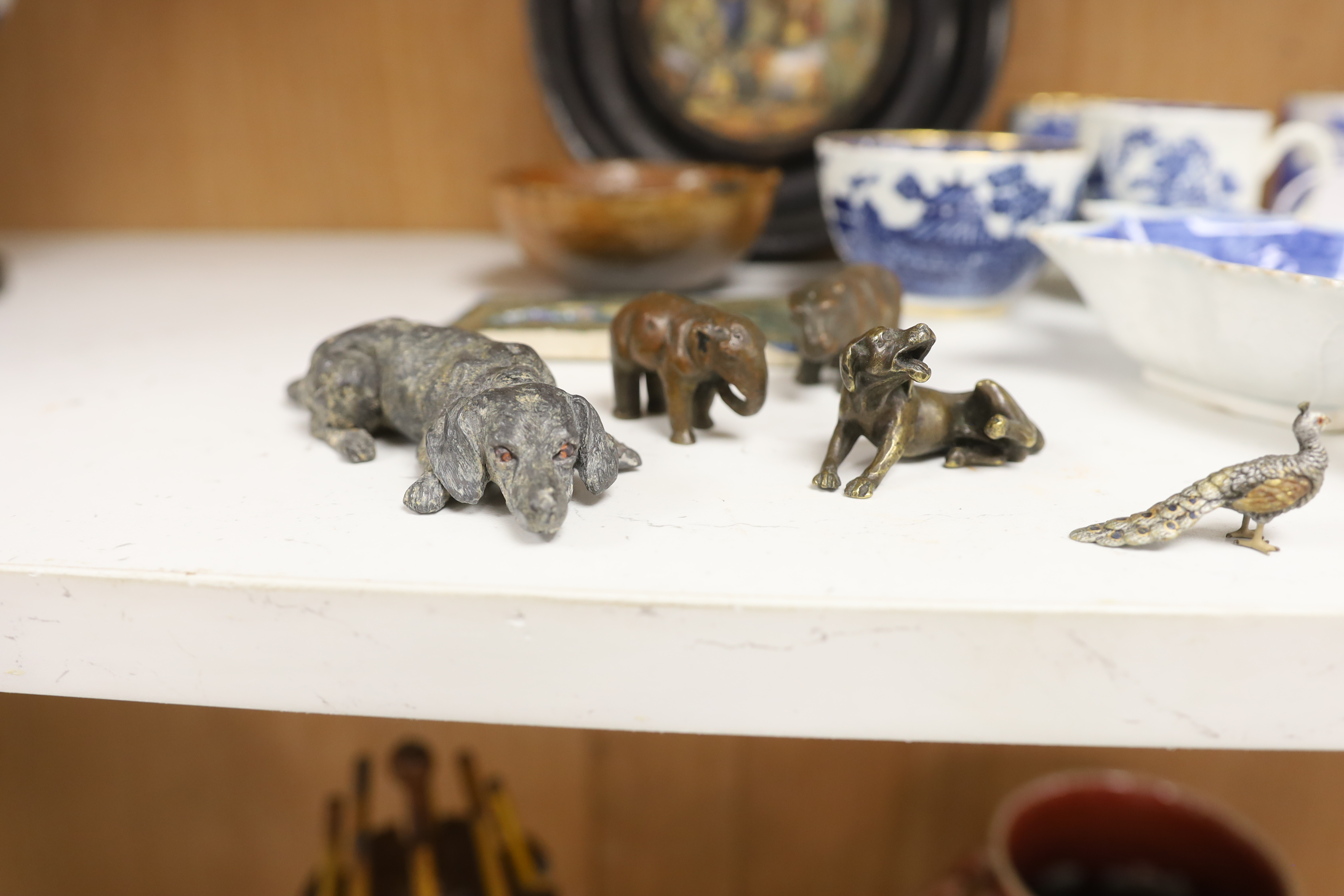 An early 20th century Viennese cold painted bronze figure of an African grey parrot, two 18th century English coffee cups, a leaf shape pickle dish, Victorian pot lid, other metal animal figures, a Japanese small carved